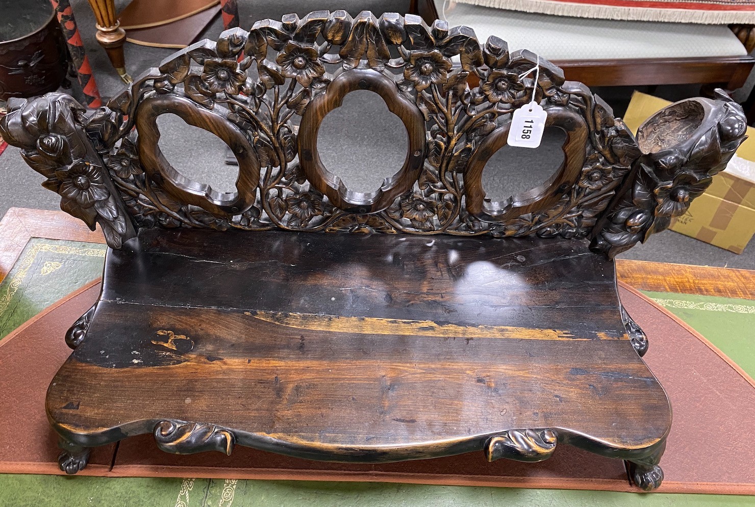 A carved hardwood Chinese stand, width 83cm